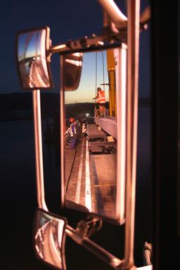 Construction workers at dusk on the Omaha Bridge